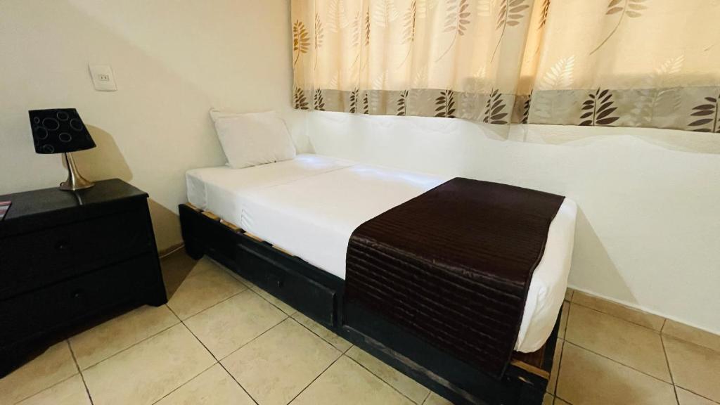 Postel nebo postele na pokoji v ubytování Hotel B&B - 5th Avenue