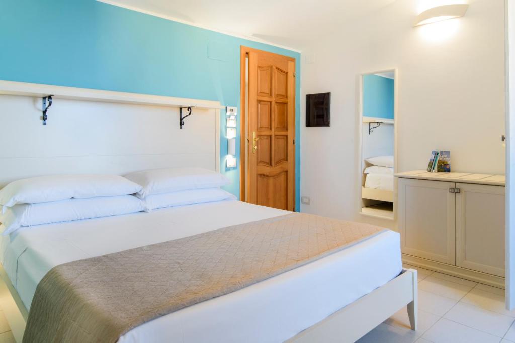 Postel nebo postele na pokoji v ubytování L'Antico Portone B&B