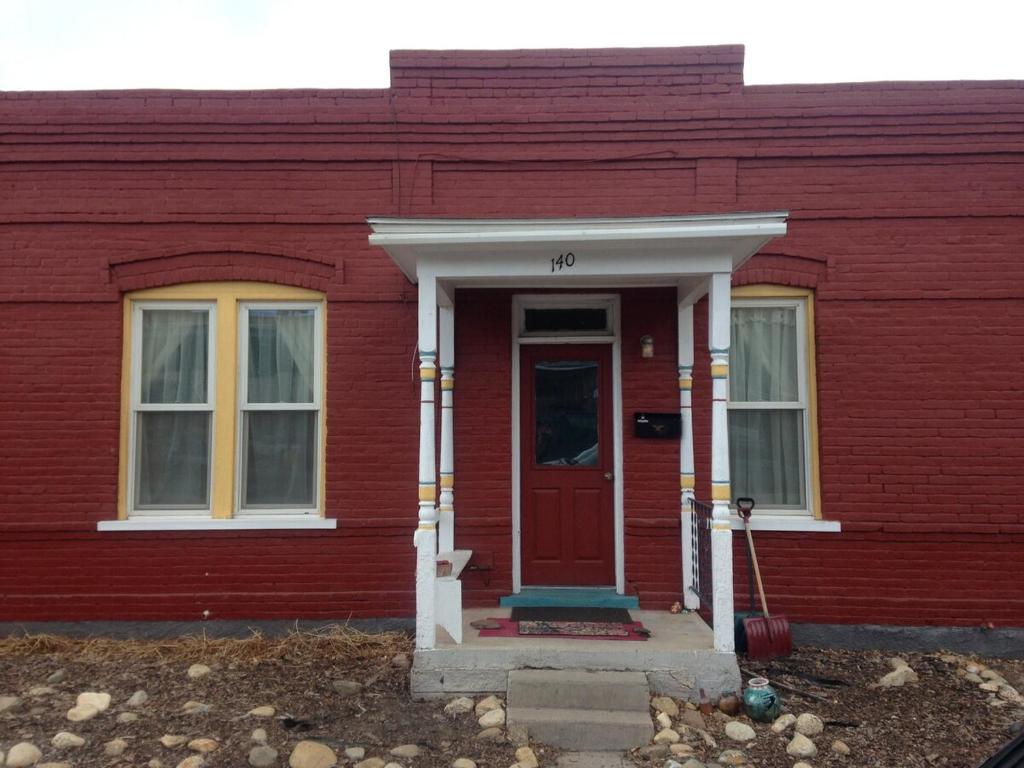 a red house with a red door and windows at La Casita Colorada, 12 Block To River Str#865 in Salida