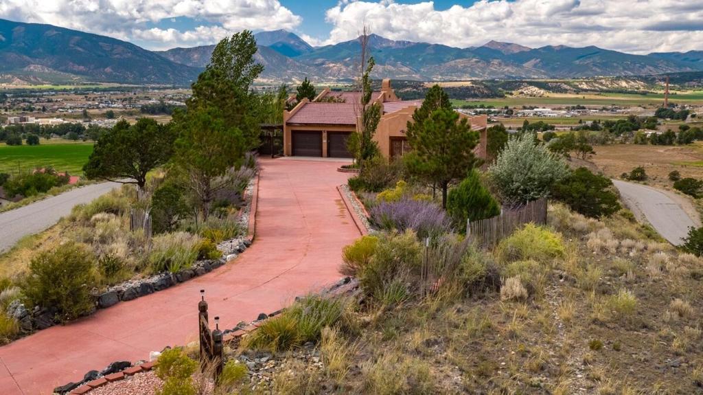 a house on a hill with a driveway at Vista Grande 1 Mi To Salida 3 Or 4 Bdrm Options in Salida