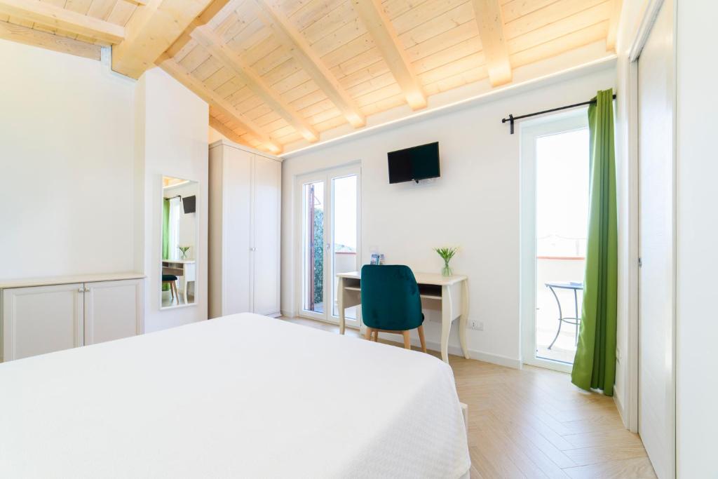 Postel nebo postele na pokoji v ubytování L'Antico Portone B&B