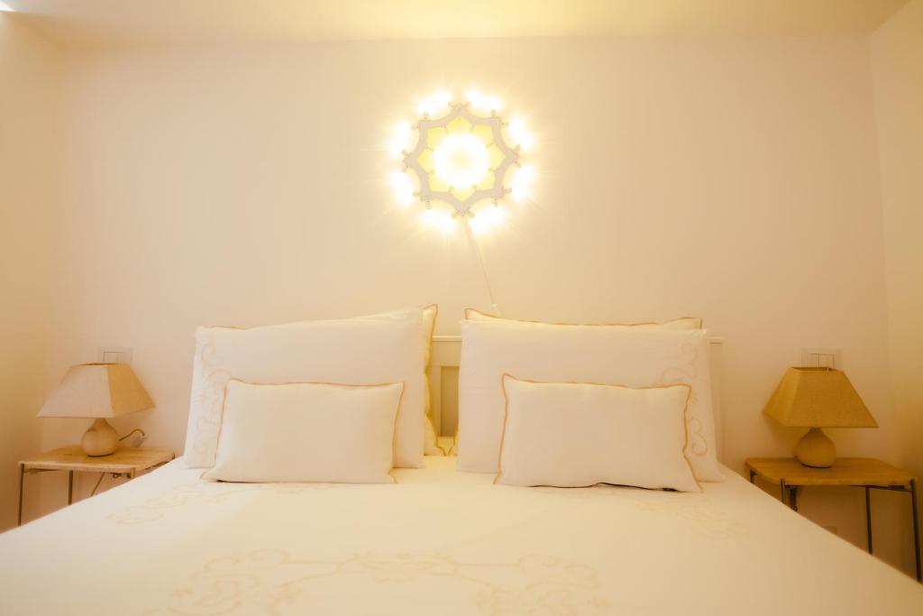 A bed or beds in a room at San Gaetano Luxury Home