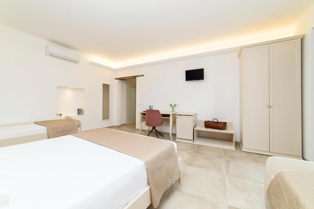 Postel nebo postele na pokoji v ubytování L'Antico Portone B&B