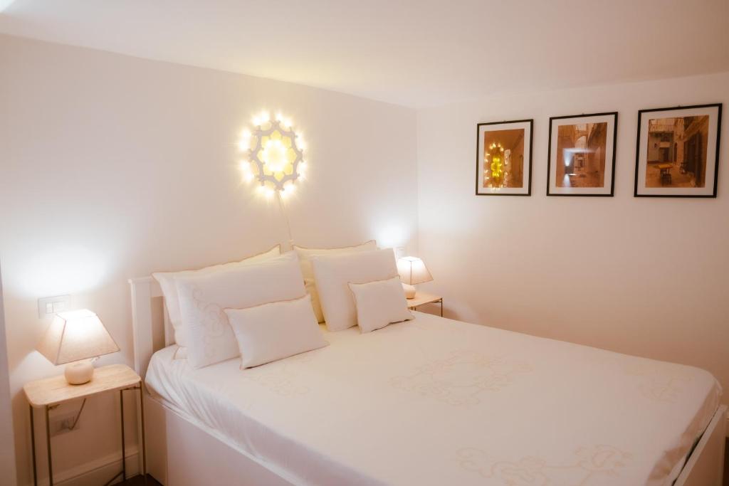 A bed or beds in a room at San Gaetano Luxury Home