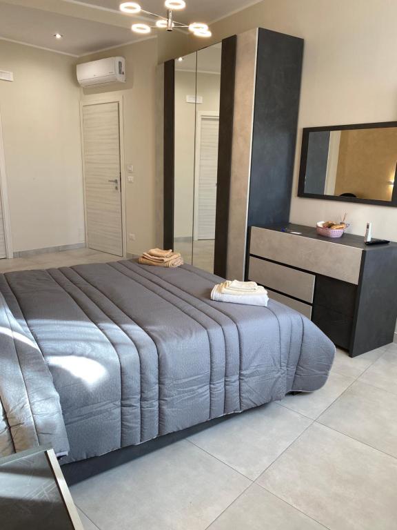Posteľ alebo postele v izbe v ubytovaní B&B San Giuseppe, nel cuore di Ortigia