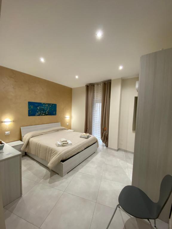 Posteľ alebo postele v izbe v ubytovaní B&B San Giuseppe, nel cuore di Ortigia