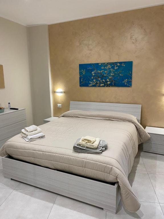 Posteľ alebo postele v izbe v ubytovaní B&B San Giuseppe, nel cuore di Ortigia