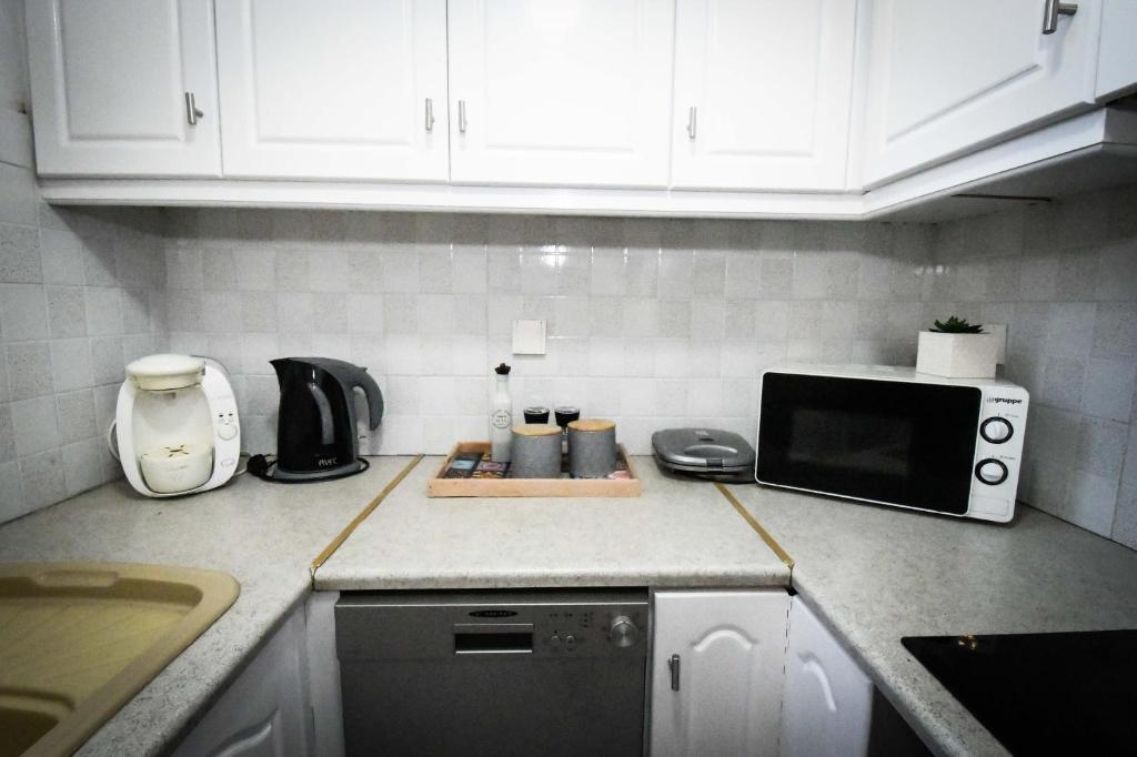 Kuchyň nebo kuchyňský kout v ubytování Joyia's Apartment