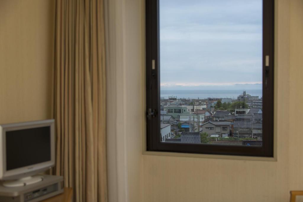 TV a/nebo společenská místnost v ubytování Sky Hotel Uozu Annex