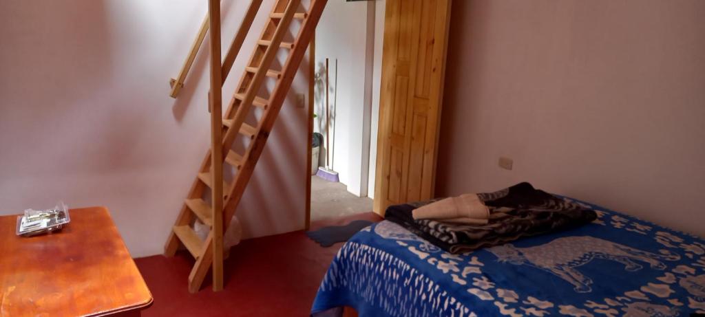 Postel nebo postele na pokoji v ubytování Hostal Doña Clarita & Vegetarían Food