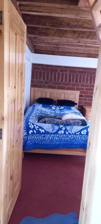 Postel nebo postele na pokoji v ubytování Hostal Doña Clarita & Vegetarían Food
