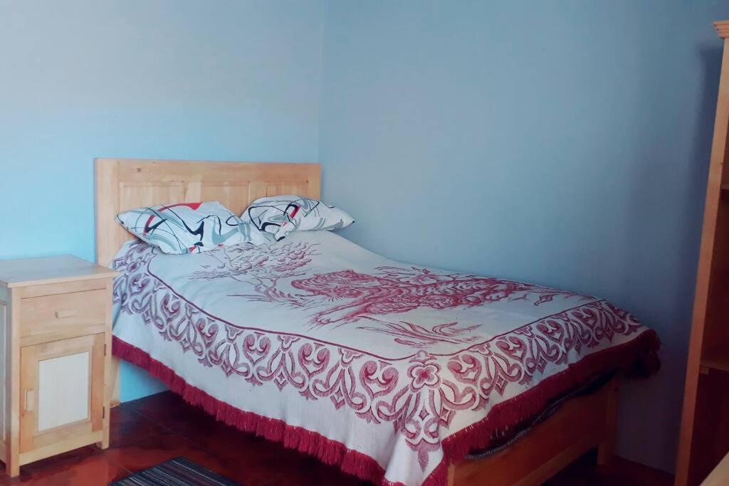 Postel nebo postele na pokoji v ubytování Hostal Doña Clarita & Vegetarían Food