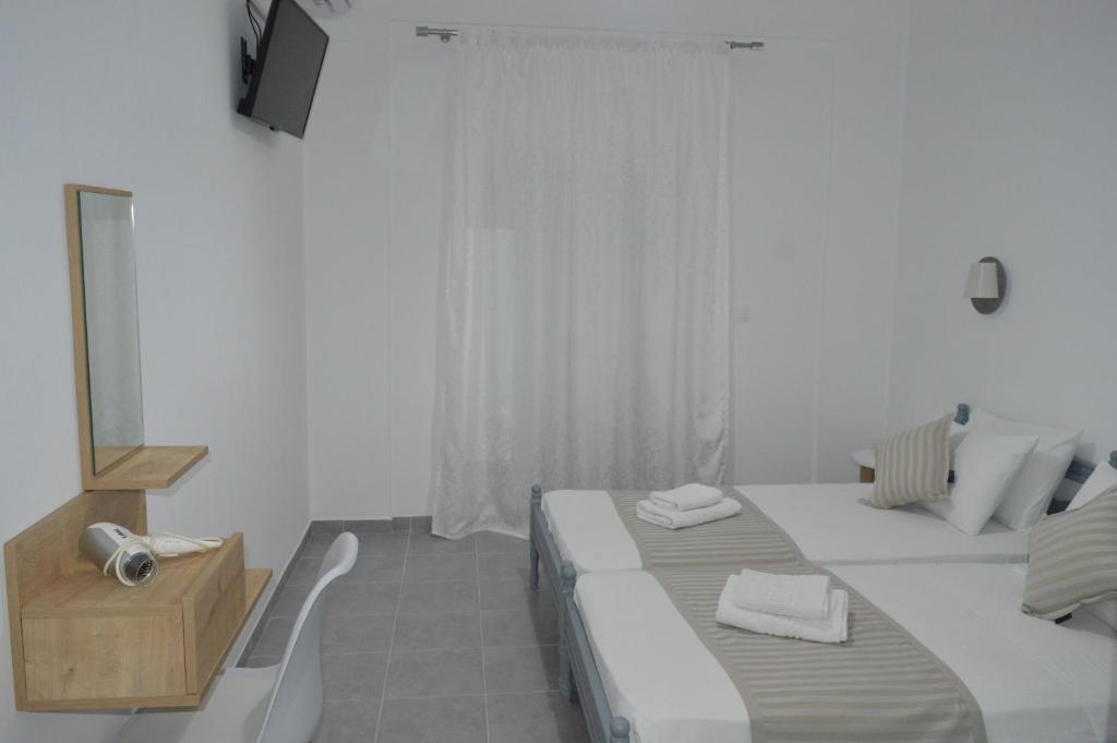 Postel nebo postele na pokoji v ubytování Pansion L'isola
