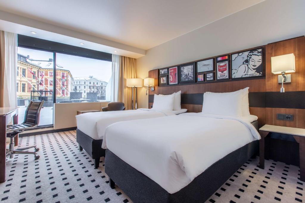 Postel nebo postele na pokoji v ubytování Radisson Blu Scandinavia Hotel, Oslo