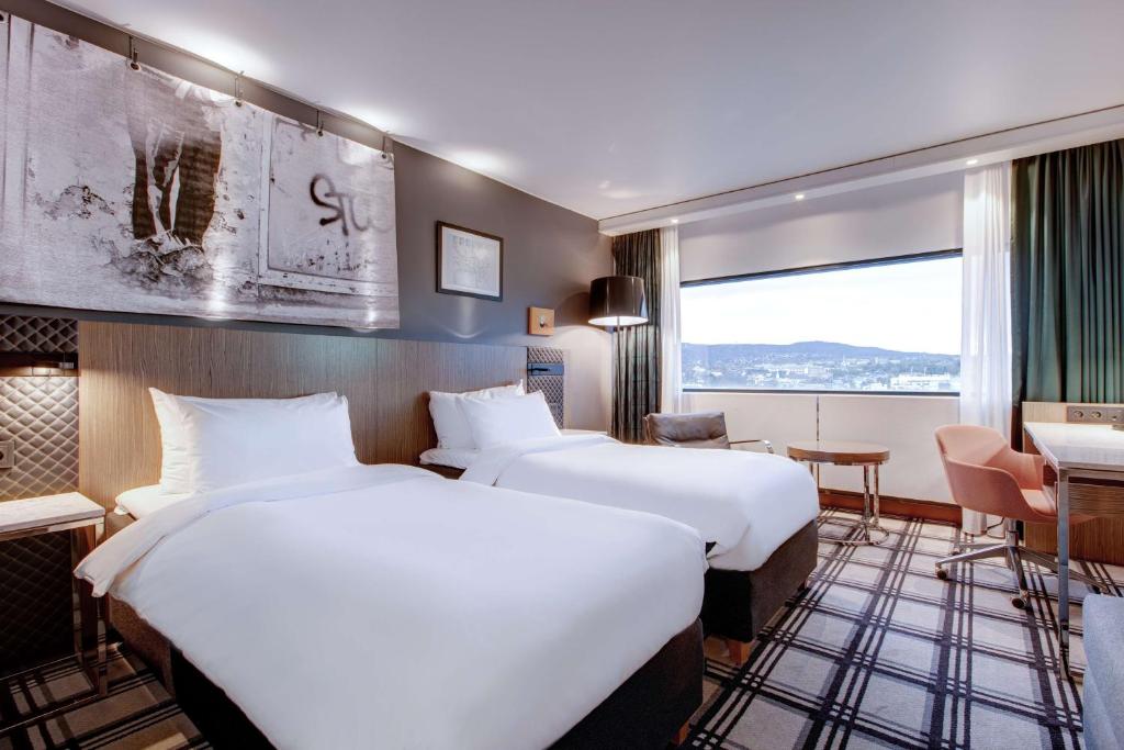 Postel nebo postele na pokoji v ubytování Radisson Blu Scandinavia Hotel, Oslo