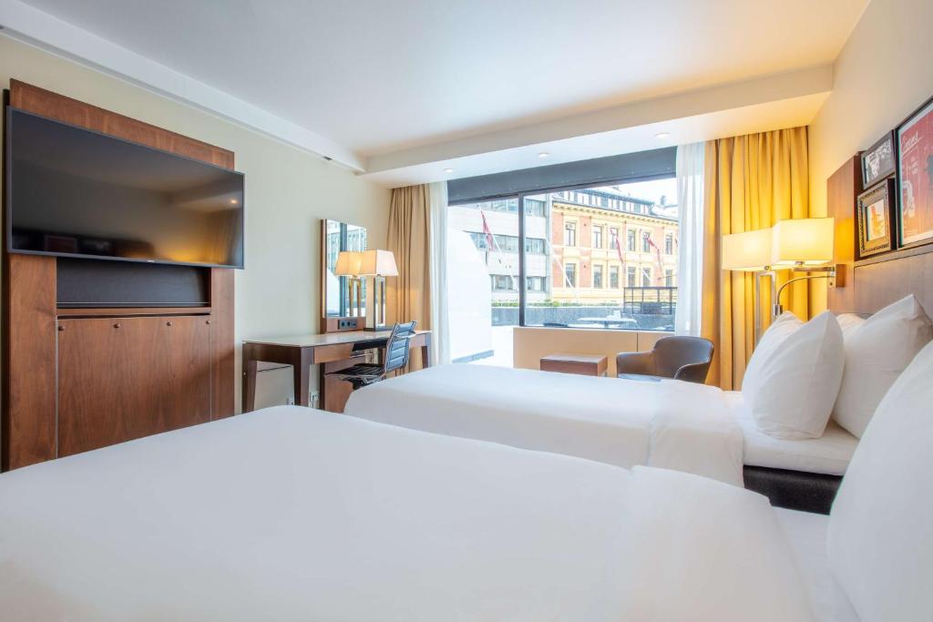Postel nebo postele na pokoji v ubytování Radisson Blu Scandinavia Hotel, Oslo