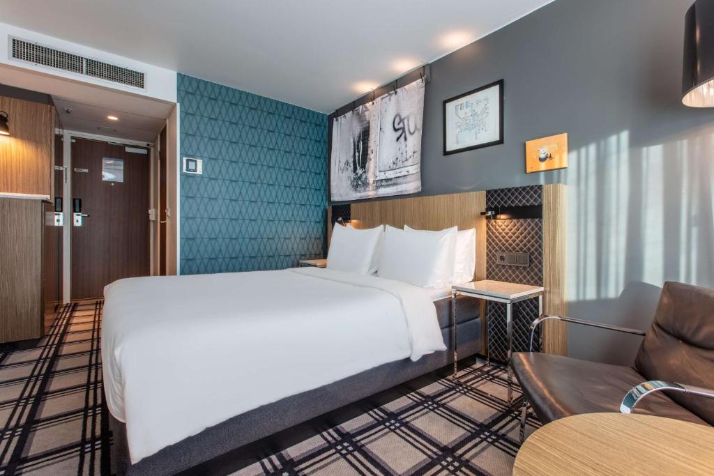 Postel nebo postele na pokoji v ubytování Radisson Blu Scandinavia Hotel, Oslo