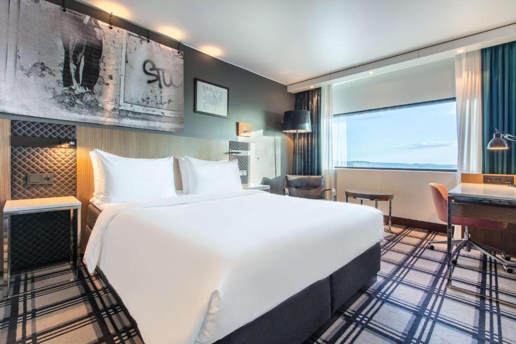 Postel nebo postele na pokoji v ubytování Radisson Blu Scandinavia Hotel, Oslo