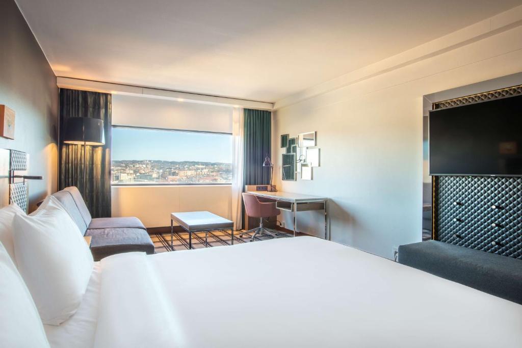 Postel nebo postele na pokoji v ubytování Radisson Blu Scandinavia Hotel, Oslo