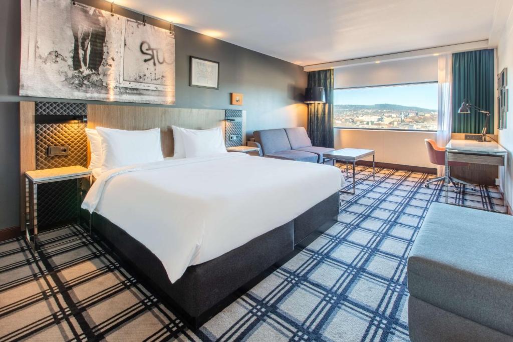 Postel nebo postele na pokoji v ubytování Radisson Blu Scandinavia Hotel, Oslo