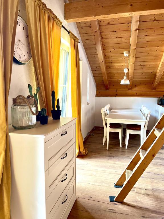 a kitchen with a table and a dining room at Gasthof Königstand in Garmisch-Partenkirchen