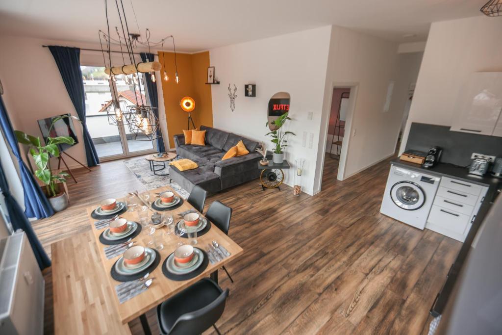 an aerial view of a living room with a table at Penthouse I 106 qm I 2 Balkone I Boxspring I Nespresso I Parkplatz in Oberharmersbach