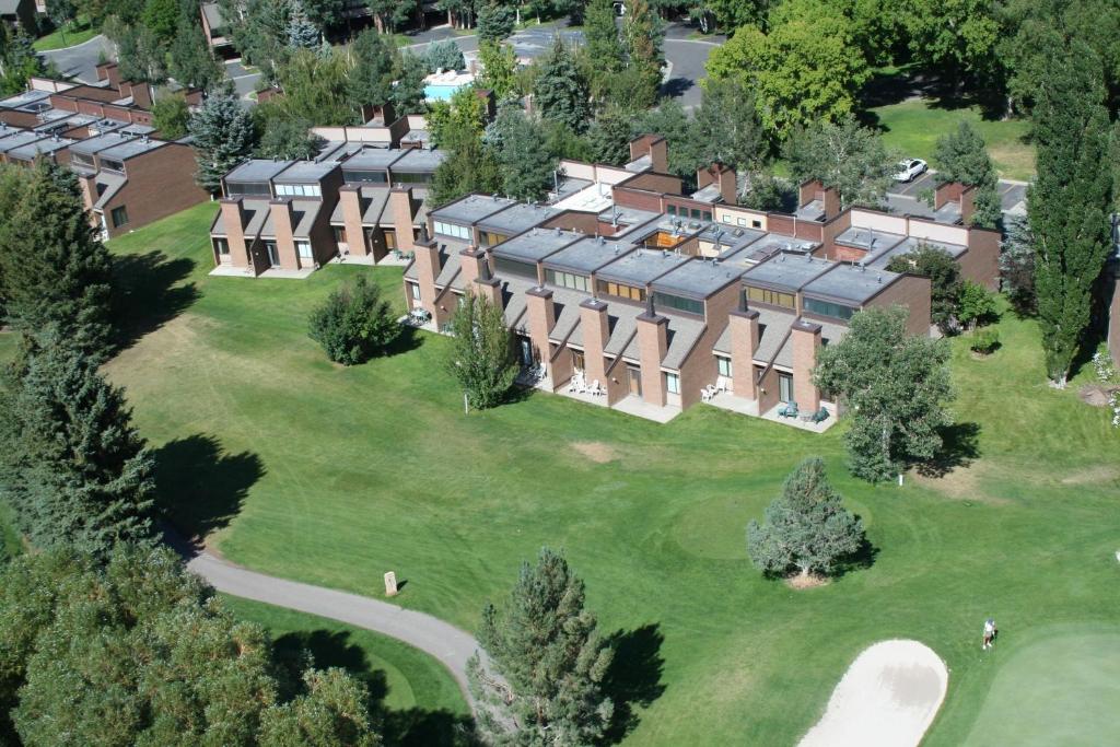 an aerial view of a large mansion with a green yard at Park Avenue Upgraded 2 Bedroom Condominiums in Park City