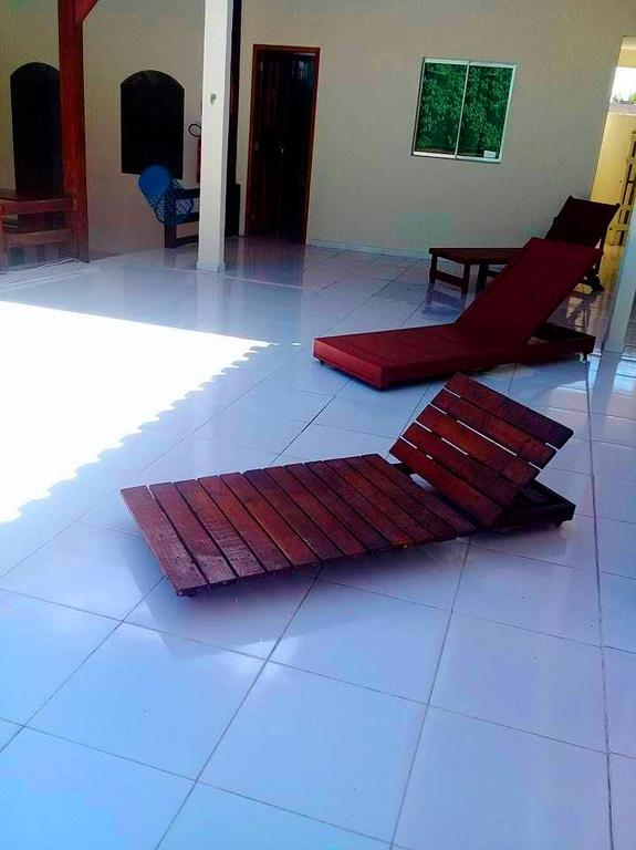two mats on the floor of a living room at Pousada da Adélia in Itaúnas