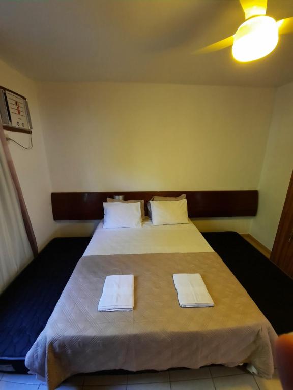 Cama ou camas em um quarto em América Flat Taperapuã