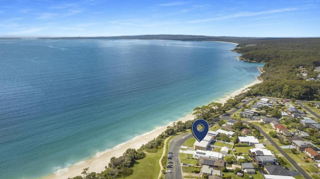 an aerial view of a beach and the ocean at Nelsons Beach House - Belle Escapes Jervis Bay in Vincentia