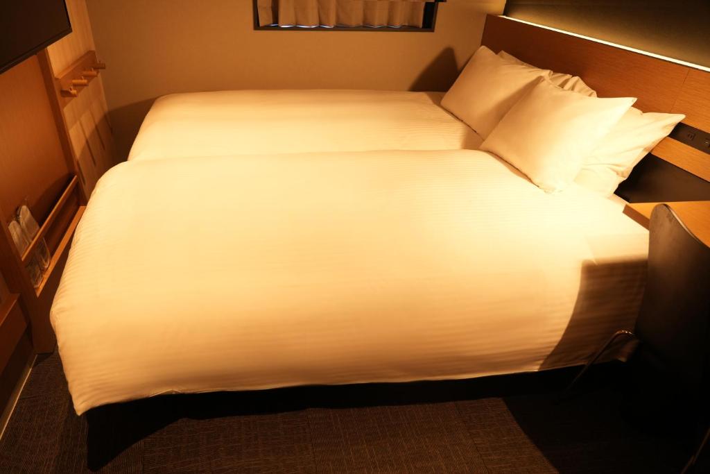 Postel nebo postele na pokoji v ubytování N Plus Hotel Akihabara