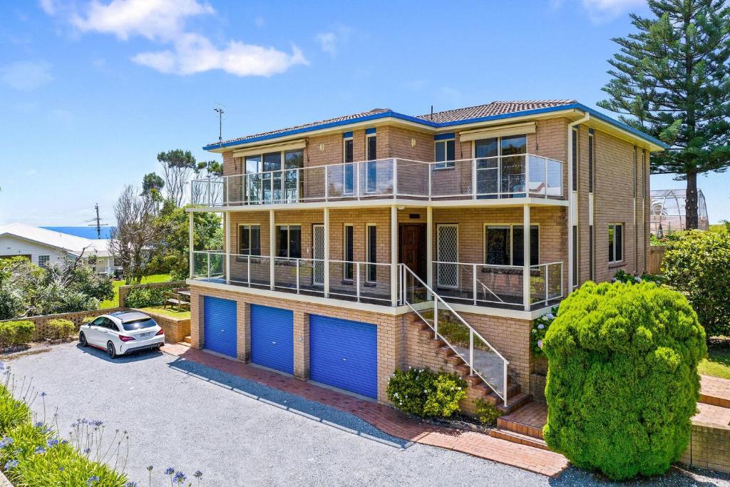 a house with a car parked in front of it at 3 Bay Lane in Narooma