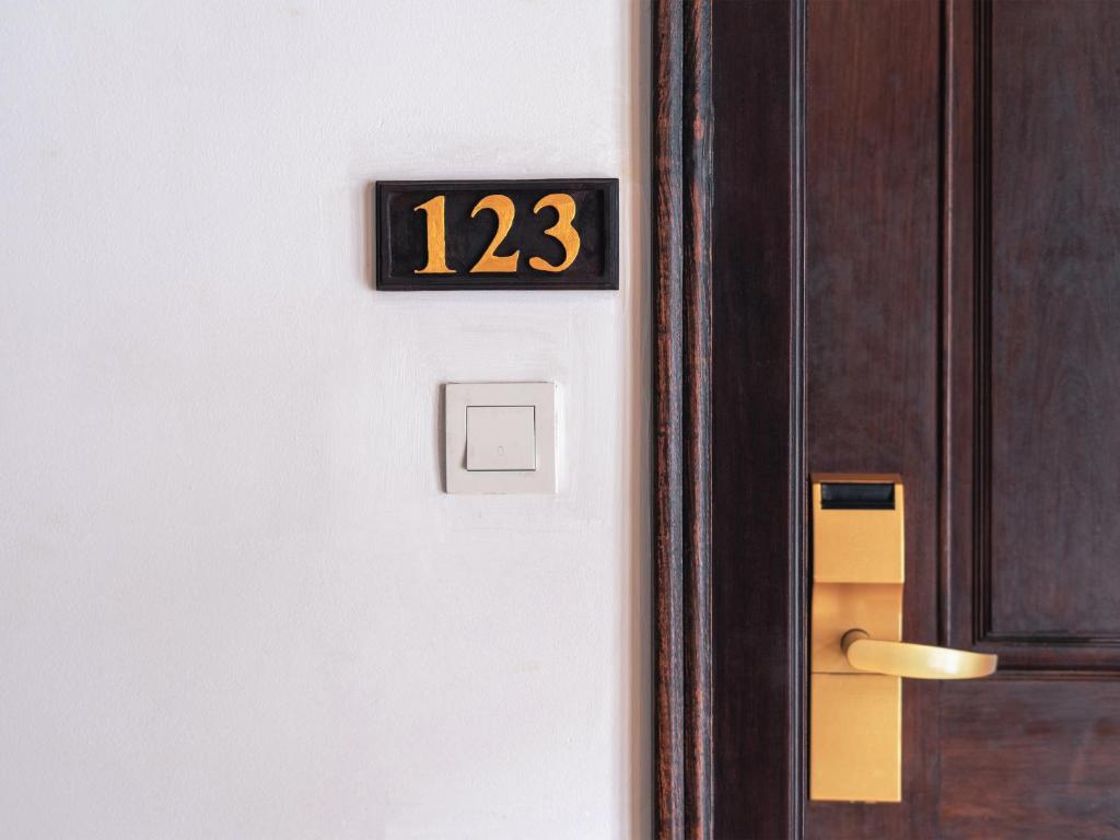 a door with the number on it at Chateau d'Angkor La Residence in Siem Reap