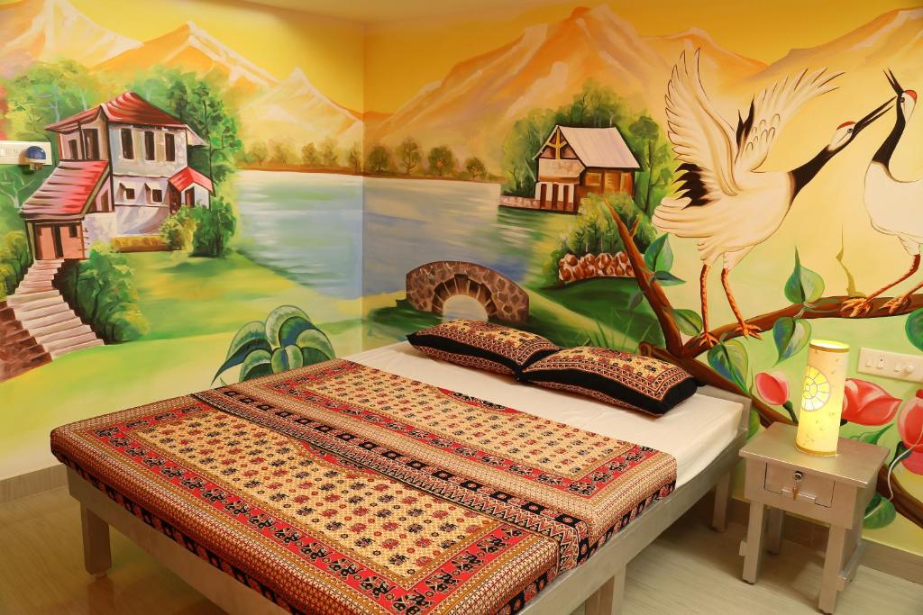 La Maison Radha tesisinde bir odada yatak veya yataklar