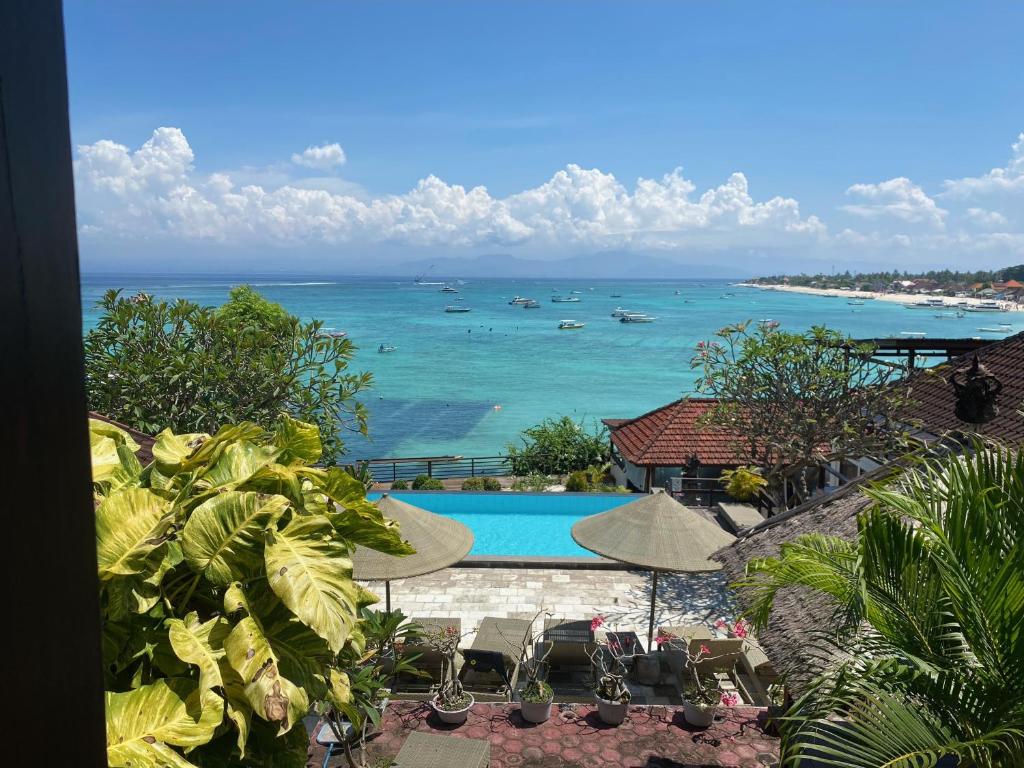 a view of the ocean from a resort with a swimming pool at Lembongan Lux Villas in Klungkung