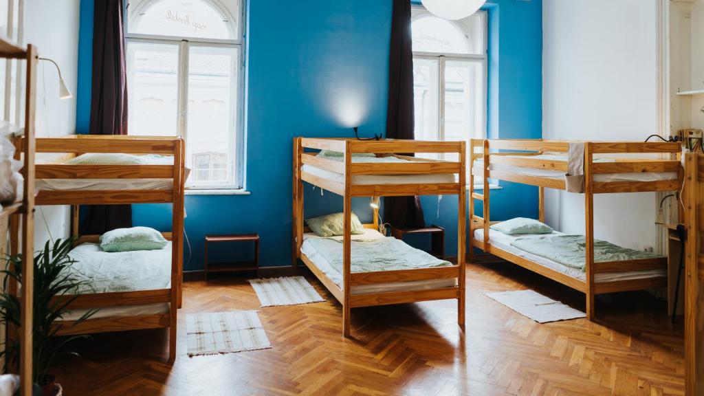 Postel nebo postele na pokoji v ubytování Nap Hostel Pécs