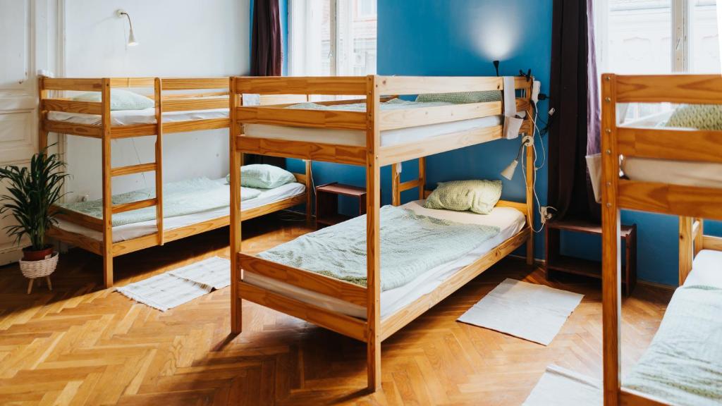 Postel nebo postele na pokoji v ubytování Nap Hostel Pécs