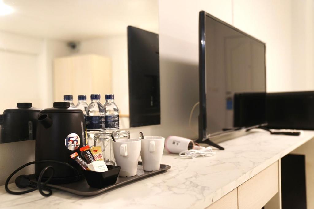 Příslušenství pro přípravu čaje a kávy v ubytování View Place Hotel & Residence