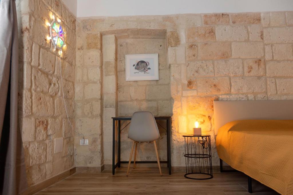 A bed or beds in a room at Apulian House