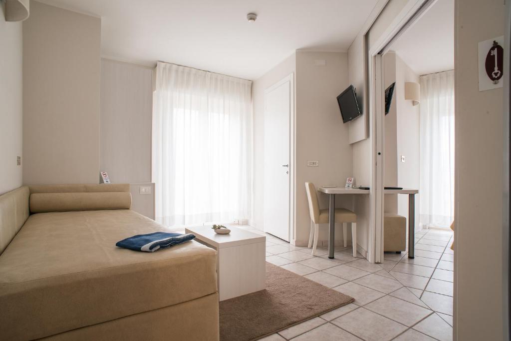TV a/nebo společenská místnost v ubytování Hotel Gabriella