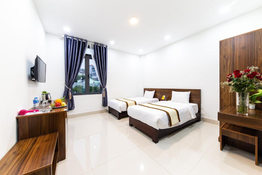 Giường trong phòng chung tại Đà Lạt Cao Nguyên Hotel