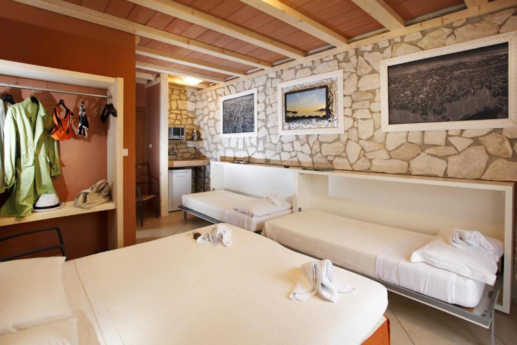 Postel nebo postele na pokoji v ubytování Albergo Garni Orchidea