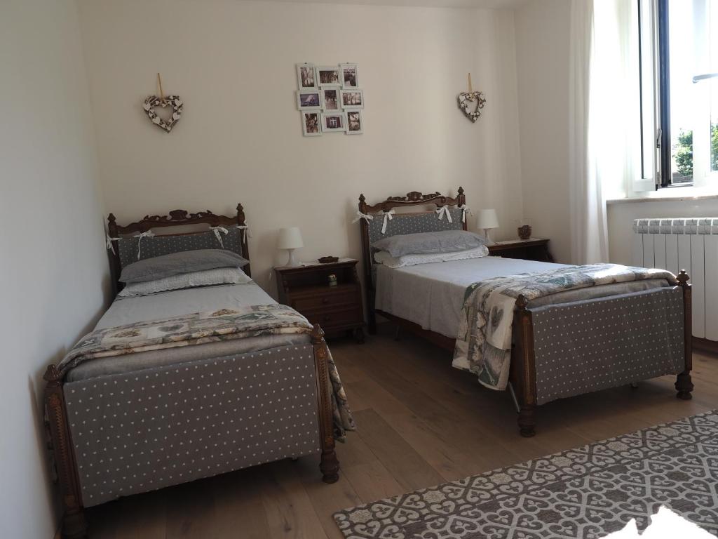 A bed or beds in a room at Casa vacanze Lepa Vida