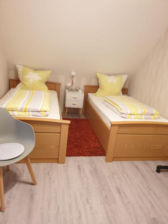 Postel nebo postele na pokoji v ubytování Ferienwohnung 24 Oben Rechts 4 Zimmer