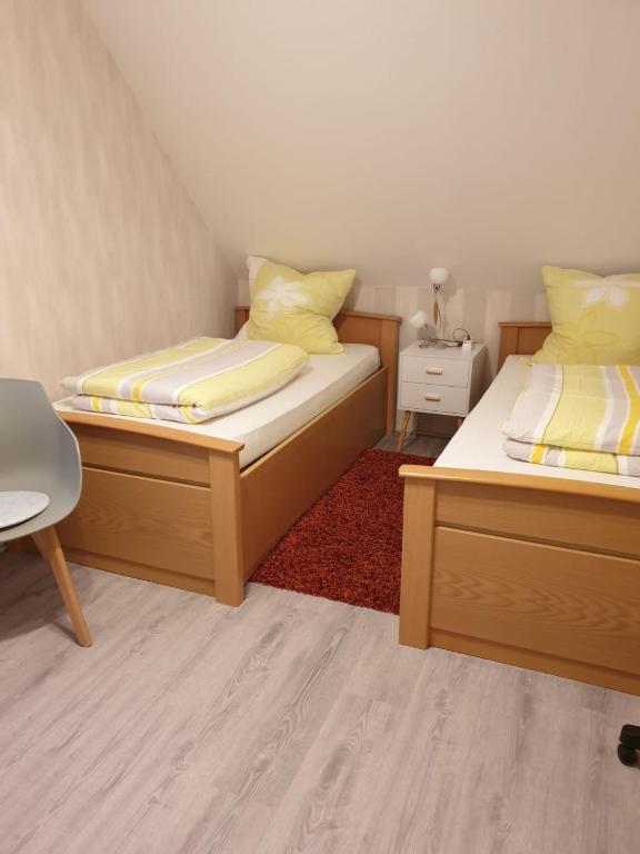 Postel nebo postele na pokoji v ubytování Ferienwohnung 24 Oben Rechts 4 Zimmer