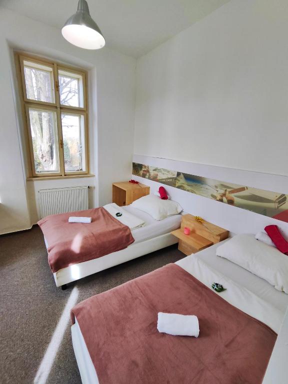 Postel nebo postele na pokoji v ubytování Hotel Stará Škola