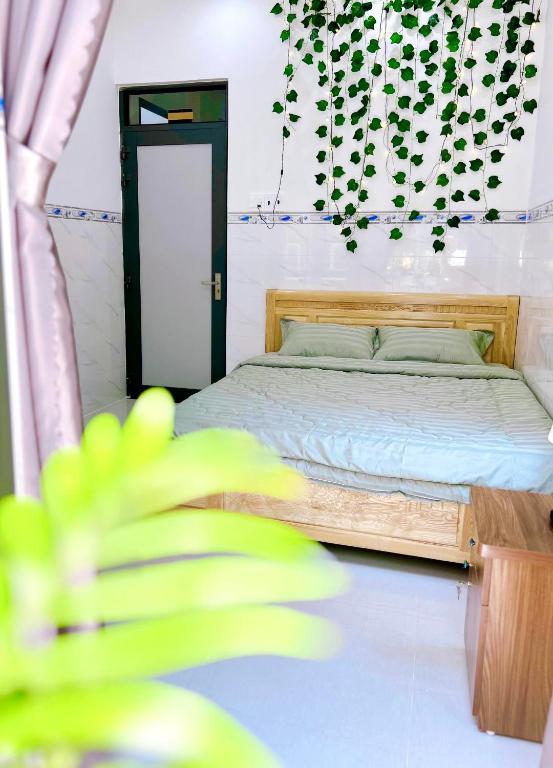 Postel nebo postele na pokoji v ubytování Suri's Homestay