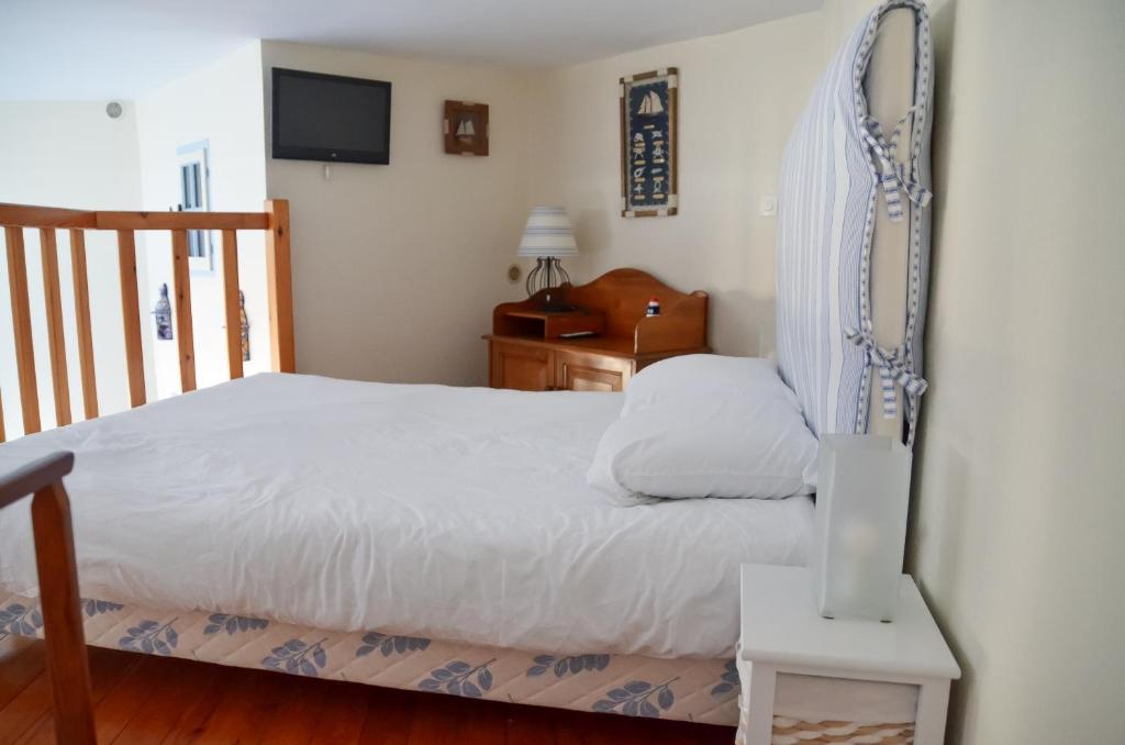 Posteľ alebo postele v izbe v ubytovaní Petite Maison de plage