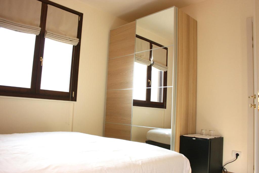 Łóżko lub łóżka w pokoju w obiekcie Agriturismo Deviscio