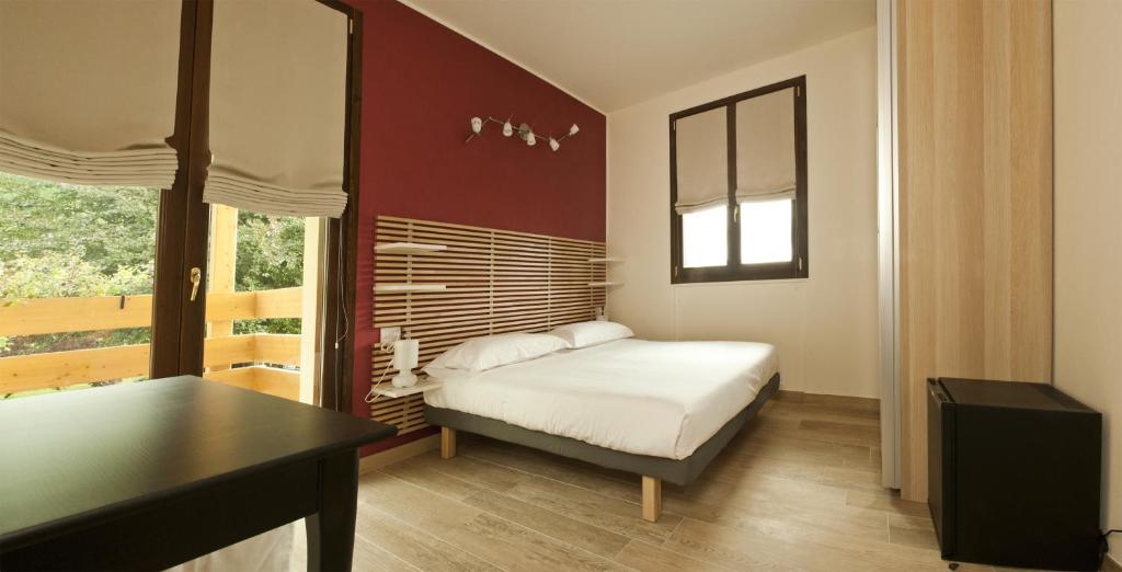 Łóżko lub łóżka w pokoju w obiekcie Agriturismo Deviscio